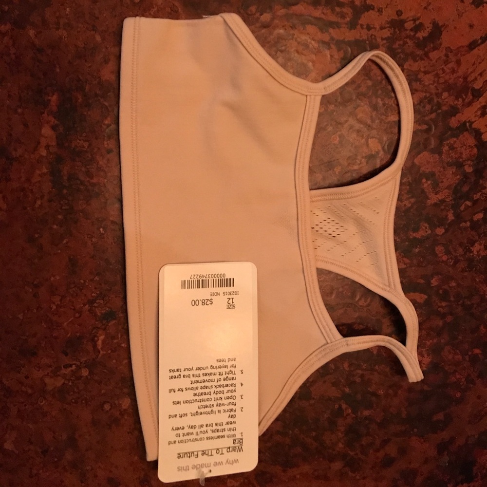 Girls bralette Nude in color. New with Tag